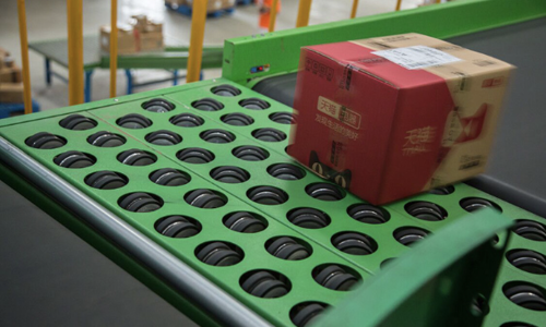 O belt-deflection wheel sorter system